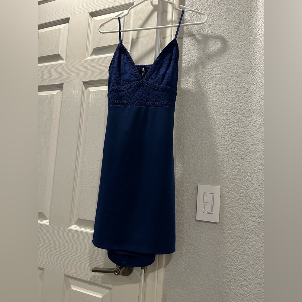 Lulu dress, V-neck, partial open back dress with lace design on top!